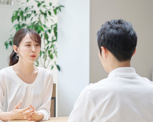 image of a woman and men having conversation