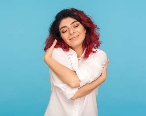 Image of a woman hugging herself